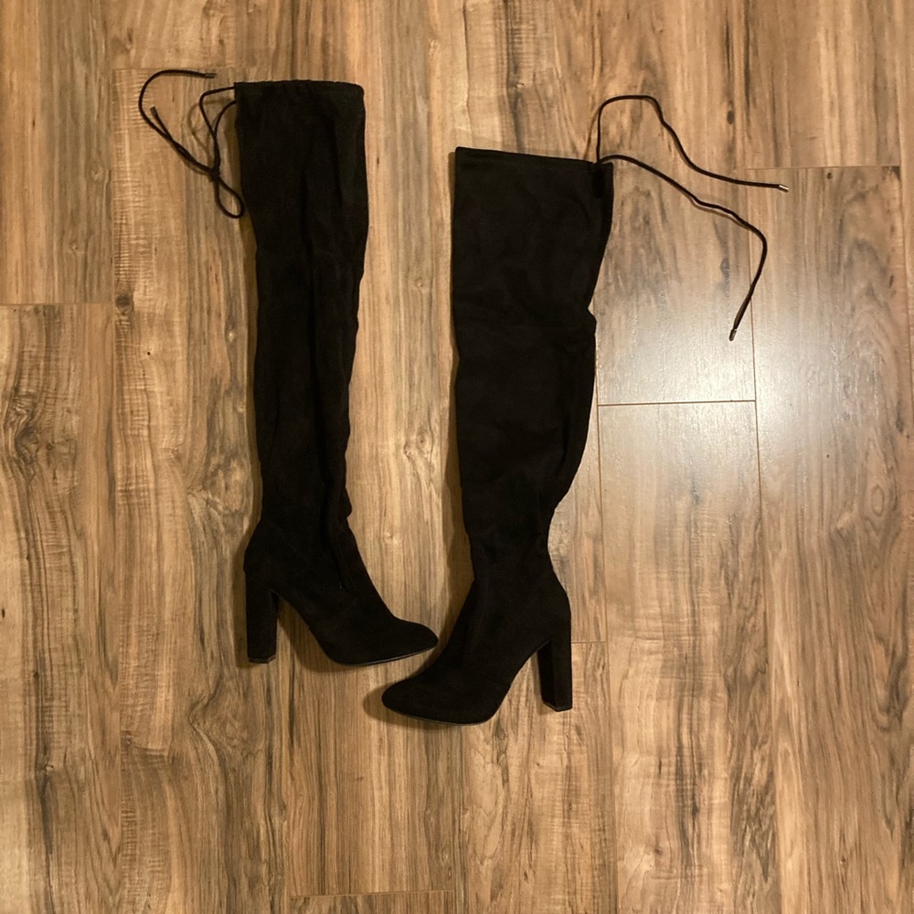 Thigh high heeled boots